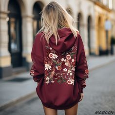 Introducing our Boho Cottagecore Floral Hoodie, the perfect way to embrace the colder seasons in style. This unique hoodie is adorned with a beautiful blend of fall and winter flowers, berries like rose hips, and striking blood red oranges, elegantly displayed on the back and sleeves. With a mix of techniques--including real pressed flowers, painted florals, and detailed sketches--this hoodie is sure to become a favorite. Whether you're taking a peaceful stroll through the park, enjoying coffee Long Sleeve Floral Print Hoodie For Fall, Winter Floral Print Hoodie Sweatshirt, Winter Floral Print Sweatshirt, Red Embroidered Hoodie For Fall, Embroidered Red Hoodie For Fall, Fall Floral Print Hooded Hoodie, Detailed Sketches, Flower Hoodie, Painted Florals