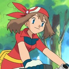 a girl in a red and yellow outfit riding a bike