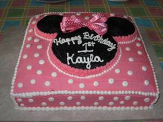 a minnie mouse birthday cake on a table