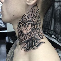 a man with a tattoo on his neck