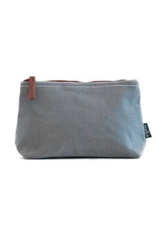 You'll love this Mini Sized Canvas Zipper Pouch! It's made with recyclable canvas and vegan leather trim, plus eco-friendly pigment ink for a stylish look. The waterproof lining wipes down easily and the zipper ring hooks on nicely to totes. With its 5” x 4” x 1” size, it's perfect for carrying small items like jewelry or accessories. Spot-clean gently as needed to keep your pouch looking great. Get ready to make a statement with this handmade, unbreakable mini sized canvas zipper pouch! Eco-friendly Canvas Bag With Removable Pouch For Everyday Use, Eco-friendly Bags With Zipper Pouch For Everyday Use, Eco-friendly Zipper Pouch Bag For Everyday Use, Black Canvas Bag With Removable Pouch For On-the-go, Canvas Zipper Pouch, Blue Zipper Closure Pouch For On-the-go, Indigo Denim, Pigment Ink, Leather Trim