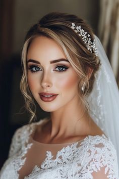 a woman wearing a wedding veil and tiara