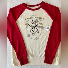 a white and red shirt with a snowman on it