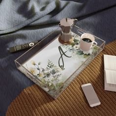 a tray that has some coffee and a book on it