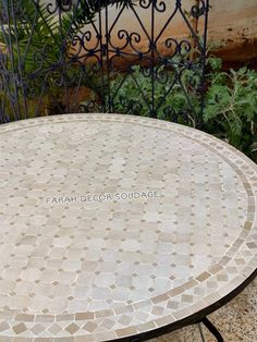 a round table sitting on top of a stone floor