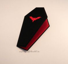 a black and red tie with a bat on it