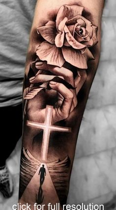 a cross and rose tattoo on the arm with an image of a person holding a flower