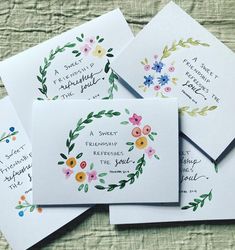 four cards with floral designs on them