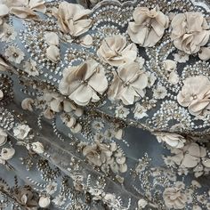 Add a touch of elegance and beauty to any special occasion with our Beaded 3D Floral Lace Fabric Embroidered on 100% Polyester Net Mesh. This luxurious fabric is handmade with a high quality, durable, heavy weight construction that is perfect for making stunning wedding dresses, evening gowns, quinceanera dresses, dance costumes and more. The fabric features a gorgeous, intricate 3D couture lace beaded design which will make a statement no matter how you use it. Craft beautiful evening dresses w Elegant Pearl Embroidered Fabric For Reception, Elegant Embroidered Fabric With Pearl Embroidery For Reception, Elegant Floral Embroidered Fabric For Wedding, Elegant Embellished Embroidered Fabric For Formal Occasions, Elegant Formal Floral Embroidered Fabric, Elegant Embroidered Fabric With Floral Applique For Party, Elegant 3d Embroidered Fabric For Party, 3d Embroidered Fabric For Spring Wedding, Elegant Floral Embroidered Fabric For Party