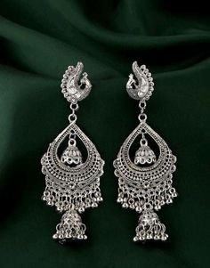 Base Metal-Alloy, Silver Platting Stone-Artificial Stone and Beads Sizing- Non adjustable Stylish Silver Oxidized Indian drop Earrings- An Eternal Classical Design. These Vintage earrings will complement any Occasion Ethnic Wear/ Daily / College / Party Wear. Produced under Quality Control; One by One Checking; Focus on Detail Processing. Top Quality/ Latest Trend Design/Anti-Allergy Beautiful Looks at One Glance- with Intricate High Polish creates Glamorous Reflections and adds Luxurious Looks. Traditional Silver Chandelier Earrings For Festive Occasions, Traditional Metal Chandbalis With Intricate Design, Festive Bollywood Style Metal Chandbalis, Traditional Metal Chandelier Earrings For Party, Festive Bollywood Metal Chandbalis, Traditional Metal Chandelier Earrings For Festive Occasions, Traditional Silver Chandelier Earrings, Silver Bohemian Jhumkas For Wedding, Traditional Chandelier Earrings With Intricate Design For Eid