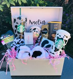 the starbucks gift basket is filled with coffee, cookies, and other goodies for someone's birthday