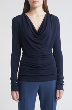 A draped neck creates lavish folds down the front of this knit top providing an intriguing counterpoint to the style's slim, figure-skimming fit. Cowl neck Long sleeves 100% viscose Machine wash, dry flat Imported Versatile Viscose Tops For Evening, Elegant Ruched Tops For Layering, Draped Tops For Workwear In Fall, Draped Fall Tops For Workwear, Elegant Draped Tops For Layering, Versatile Ruched Top For Evening, Versatile Ruched Evening Top, Elegant Fine Knit Elastane Tops, Chic Fitted Knit Top With Foldover Design