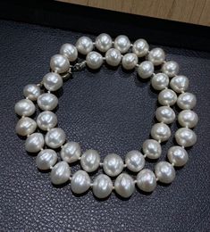 Big Size Round Pearl Necklace - Freshwater Pearl Beads - Minimal Peral Necklace - Bridesmaid Gift   Shape : Round Pearl Beads  Type    : Freshwater Pearl  Color   : White  Weight : 68.88 gram approx  Beads : 40-45 Beads About Pearls -  As we now know, freshwater pearls form in lakes, rivers, and other non-salted water. Over 90% of freshwater pearls are known as baroque pearls. This means they have an irregular shape, the most abundant type. This irregular shape is what makes them so beautifully Classic Polished Pearl Necklace For Wedding, Classic Wedding Pearl Necklace With Polished Beads, Classic Polished Beaded Necklaces For Wedding, Classic Handmade Pearl Necklace With Round Beads, Single Strand Pearl Bridal Necklace With Round Beads, Classic Wedding Beaded Necklace With Polished Beads, Pearl Bridal Necklace With Single Strand Of Round Beads, White Polished Pearl Necklace For Formal Occasions, Formal Pearl White Beaded Necklace