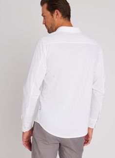 Our signature City Tech Classic Shirt looks like a dress shirt, feels like a t-shirt making it the perfect blend of sophistication and modern-day comfort. With four-way stretch, a standard fit and a slightly curved hem this shirt allows you to transition from a day at the office to an evening out with ease. The micro pique shape retention fabric naturally releases wrinkles and provides superior durability so you can keep reaching for your City Tech Classic Shirt again and again with confidence. Modern Shirttail Hem Shirt For Business Casual, White Shirttail Hem Shirt For Business Casual, White Business Casual Shirt With Shirttail Hem, Casual Shirt With 4-way Stretch For Workwear, Casual 4-way Stretch Shirt For Work, Fitted Versatile White Shirt, Chambray Button-up Shirt With Pockets, Washed Chambray Button-up Shirt, Gray Technical Short Sleeve T-shirt