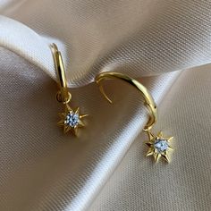 14K Gold plated 925 Sterling Silver Star hoop earrings. Minimalist style. Everyday jewelry made with love. ...............................DETAILS• 14K Gold Plated • 925 Sterling Silver • AAA Cubic Zirconia Stone• Also available in 14K White Gold...............................MEASURESHoop Diameter: 16mm (1.6cm) Charm Size:10mm (1cm) Elegant Gold Hoop Earrings With Star Charm, Everyday Yellow Gold Earrings With Star Charm, Celestial Gold Plated Tarnish Resistant Hoop Earrings, Celestial Style Gold-plated Yellow Gold Hoop Earrings, Dainty Gold Plated Earrings With Star Charm, Dainty Gold-plated Earrings With Star Charm, Celestial Style Yellow Gold Plated Hoop Earrings, Celestial Gold-plated Tarnish Resistant Hoop Earrings, Celestial Gold-plated Tarnish-resistant Hoop Earrings