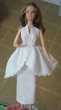 a barbie doll dressed in a white dress