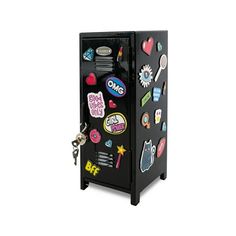 a black refrigerator with lots of stickers on it's door and keychain