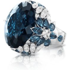 Crafted with the utmost care and attention to detail, this 18k white gold ring from Pasquale Bruni's Ghirlanda Couture collection is the epitome of elegance and sophistication. Its exquisite design is further enhanced by the striking London Blue Topaz that takes center stage, exuding a sense of tranquility and calmness. The deep, rich hue of the gemstone is perfectly complemented by the brilliant diamonds that adorn the band, creating a sense of harmony and balance.As you slip this ring onto you Pasquale Bruni, Diamond Birthstone, Jewelry Appraisal, London Blue Topaz, London Blue, Diamond Wedding Rings, Cocktail Rings, Jewelry Branding, Luxury Jewelry