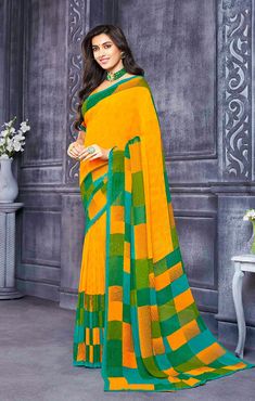 This saree is Ready to Wear (With Fall and Pico Done). Traditional Printed Saree, made up of creative work and graceful fabrics Georgette Comes with 80 cm blouse piece in the saree border Length: 6.30 Meter With Blouse Made up of Pure Fabric Must have saree for your festive collection This saree is a suitable amalgamation of style and grace that is required from ethnic wear. The saree is ideal for any formal gathering. The saree comes with an unstitched blouse of corresponding color and design a Yellow Semi-stitched Blouse Piece With Printed Border, Semi-stitched Yellow Blouse Piece With Printed Border, Yellow Semi-stitched Saree With Printed Border, Semi-stitched Yellow Saree With Printed Border, Bollywood Style Yellow Saree With Printed Border, Festive Yellow Saree With Printed Border, Festival Yellow Blouse Piece With Printed Border, Multicolor Georgette Blouse Piece For Puja, Yellow Chanderi Blouse Piece With Printed Border