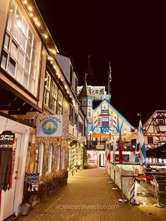 an image of a street that is lit up for the holiday season with lights on it