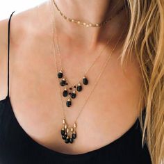 Glittering black spinel gemstones are hand wrapped in gold and suspended from 14k gold filled pieces beads.  This necklace is gorgeous to wear alone or layer with other pieces.PICTURED WITHBlack Spinel Wingspan Necklace :Gold Choker Wrap Necklace : http://ow.ly/xkFL306abdC...................................................................................................................• Measurements : Necklace is adjustable from 21"-24" in length.• Materials : Black spinel, 14k gold filled.• Cle Minimalist Beaded Onyx Jewelry, Minimalist Onyx Beaded Jewelry, Elegant Beaded Black Spinel Jewelry, Elegant Gold Necklaces With Black Beads, Elegant Gold Necklace With Black Beads, Gold Onyx Gemstone Beaded Necklaces, Gold Onyx Beaded Necklaces With Gemstone Beads, Dainty Gold Beads Jewelry For Party, Minimalist Onyx Jewelry With Black Beads