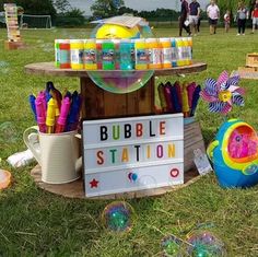 bubble station on display in the grass at an outdoor event