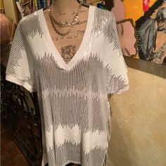 This Is A Fun And Jazzy Sequin Top. This Silver And White Top Can Be Paired With Many Pieces. Trimmed Neckline And Sleeves . 100% Polyester. White Tops For Summer Night Out, White Short Sleeve Top For Night Out, Spring V-neck Tops With Sequins, Trendy V-neck Sequin Top, White V-neck Top For Party, Spring V-neck Sequin Tops, White Sequined Tops For Night Out, Beach Sequined Stretch Tops, Beach Tops With Sequins And Stretch Fit