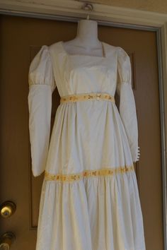 "Prairie dress. No tags - looks hand made. Very heavy. Zips in the back. In good condition!. I would guess it to be a size small- please see measurements. Measurements taken across front laid flat 18\" across front armpit to armpit 14.5\" across front of empire waist 56\" length" Fitted Cream Victorian Dress With Long Sleeves, Spring Regency Style Long Sleeve Prairie Dress, Spring Regency Style Prairie Dress With Long Sleeves, Retro Square Neck Dresses With Lace Trim, Fitted Long Sleeve Peasant Dress With Ruffles, Spring Vintage Long Sleeve Regency Dress, Fitted Vintage Victorian Dress With Square Neck, Fitted Long Sleeve Regency Vintage Dress, Regency Style Vintage Long Sleeve Fitted Dress