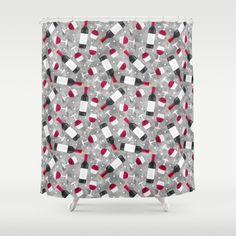 a gray shower curtain with red and white squares on it, in the middle of grey background