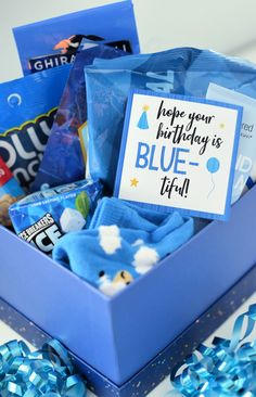 a blue box filled with candy and candies