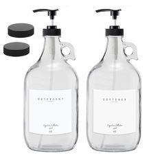 two bottles with soap dispensers next to each other on a white background