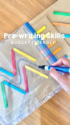 a person is painting colored pencils on a piece of paper with the words prewring skills budget friendly