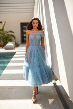 This dress has its full right to be placed in the top ranking of dresses for special occasions. This tender one-shoulder dress in light blue with a tulle skirt will be a lifesaver in moments when you need something lavish yet easy-breezy. Best part? This tulle dress is ready to ship for free! One Shoulder Tulle Prom Dress, One-shoulder Tulle Prom Dress, Light Blue Strapless Tulle Dresses, Strapless Light Blue Tulle Dress, One Shoulder Tulle Evening Dress For Spring, Spring One Shoulder Tulle Evening Dress, Spring One-shoulder Tulle Evening Dress, Strapless Tulle Midi Dress For Prom, Strapless Tulle Midi Dress