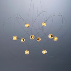 a chandelier with five lights hanging from it