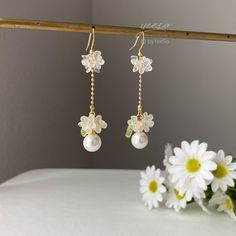 Floral Pearl Dangle earrings, Pearl drop earrings with delicate white flowers, Unique Bridesmaid Earrings, Unique Bridal Party Earrings 🤍 Hypoallergenic 🌸 Handmade with love ✨ Cute & Dainty  🎁 Gift ready 〰️Click👇🏻 Find more Earrings🎀  https://www.etsy.com/shop/byYeeSo ◽️ PACKAGING ◽️  * The jewelry will be nicely packaged * Comes with a drawstring suede pouch * If you need personalized gift note, please click the link below, add it to your cart when check out to upgrade your packaging. https://www.etsy.com/listing/1008661207/upgrade-gift-packaging?ref=shop_home_active_1&frs=1 ◽️ SHIPPING ◽️ * USPS First Class Shipping Service with tracking number * All products will be shipped from USA ◽️ CARE INSTRUCTIONS ◽️ * Avoid perfumes or sprays * Avoid getting your jewelry wet * Wipe down the Bridal Jewelry Pearl Earrings, Bridal Party Earrings, Earrings Pearl Drop, Flowers Unique, Unique Bridesmaid, Pearl Dangle Earrings, Diy Bracelet Designs, Party Earrings, Earrings Pearl