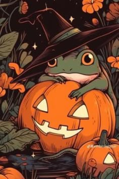 a frog wearing a witches hat sitting on top of a pumpkin