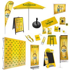 an assortment of advertising materials including umbrellas, signs and other items are displayed on a white background