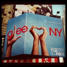 an advertisement for glee new york on the side of a building