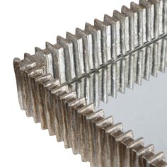 a mirror that is made out of metal