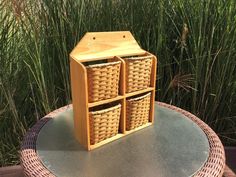 three wicker baskets sit on top of a table