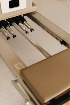 an open drawer with several knives in it