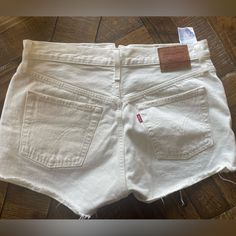 W28 Levi’s Strauss 501 Shorts. Never Worn No Stains, Pet Free, Smoke Free Home. White Bottoms With Frayed Hem And Short Length, White Short Length Bottoms With Frayed Hem, Vintage White Jean Shorts, Vintage White Jean Shorts For Spring, Levi's Cotton Cutoff Shorts, Levi's Cutoff Cotton Shorts, Vintage White Cotton Jean Shorts, White Cotton Vintage Jean Shorts, Vintage White Bottoms For Summer