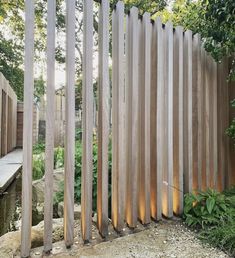 a wooden fence with lights in the middle