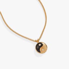 Just as day turns to night, dark and light hold in eternal balance, maintaining a sacred symmetry. This Black Onyx Yin Yang necklace, in 14kt gold plate, is a wearable symbol of that divine balance. The yin yang charm, one half black onyx and one half textured gold plate, has sparkling cubic zirconia accents on both sides. On the back, the charm says “strength and intuition,” as a reminder that it all comes from within. This necklace is adjustable between 18” and 20”. Chain length: 20", adjusts Ying Yang Jewelry, Yin Yang Jewelry, Yin Yang Charm, Yin Yang Necklace, Dark And Light, One Half, Ying Yang, Cross Bracelet, Charm Bangle