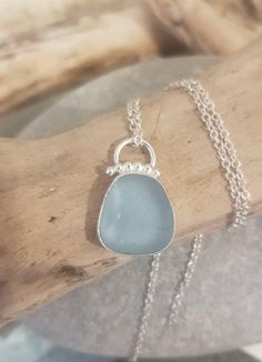 Gorgeous light blue seaglass bezel set in sterling silver finished with tiny beads and circular bail.  Handcrafted in the northeast of England with seaglass collected from the shores of the award winning Whitley bay beach.   18" chain. Seaglass Jewelry, Beach Glass Necklace, Life Jewelry, Tiny Beads, Jewellery Inspiration, Accessories Style, Wire Wrapped Necklace, Chic Jewelry, Creative Jewelry