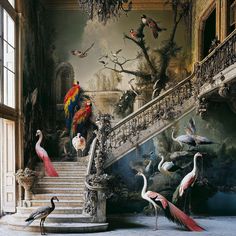 several birds are standing on the stairs in front of a painting that looks like it has been painted