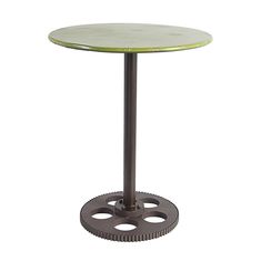 a round table with an iron base and green top