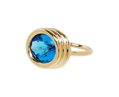 With its signature design and stunning, vibrant color, this Beck Jewels ring has a modern simplicity. The heavy, three tiered polished 18K yellow gold setting surrounds the bright blue faceted topaz. It's set at the center of the polished 18K yellow gold U band. Perfect on an index or middle finger for a pop of cool toned color. ring face : 5/8" x 3/4"blue topaz : 12mm x 16mm : 8.00ct18K yellow gold band width : 2mmsize available : 7please contact us for sizing options Modern Yellow Gold Blue Topaz Ring, Modern Yellow Gold Topaz Ring With Polished Finish, Modern Gold Blue Topaz Ring, Modern Gold Rings With Blue Topaz, Modern Gold Topaz Ring, Modern Yellow Gold Topaz Ring With Bezel Setting, Modern Blue Faceted Rings, Daniela Villegas, Alice Cicolini