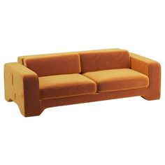 an orange couch sitting on top of a white floor