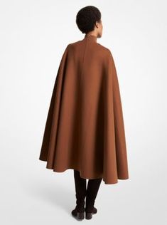 Cut from structured melton wool and designed with crisp minimalist lines, this cape is a sleek stand-in for an overcoat. Play with proportions and team it with a mini dress and oversized belt in the same rich hue—as seen on the Fall/Winter 2023 runway. Made in Italy. Winter 2023 Runway, Oversized Belt, Cape Style, Michael Kors Collection, Winter 2023, The Fall, Cape, Fall Winter, In Italy